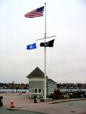 Eugene O'Neill Centennial Statue next to Flagpole- (thumbnail)